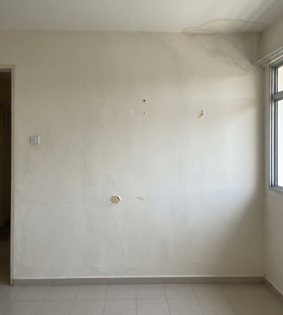 Wall before repainting with peeling paint